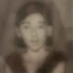 Little girl wearing black gloves