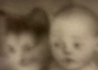 Baby and Cat fascinated by the same Ball and String